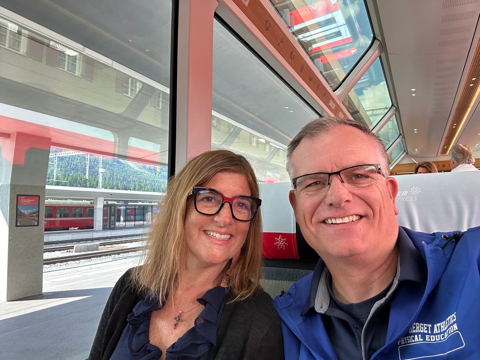 Chuck and Leslie smiling aboard the Glacier Express