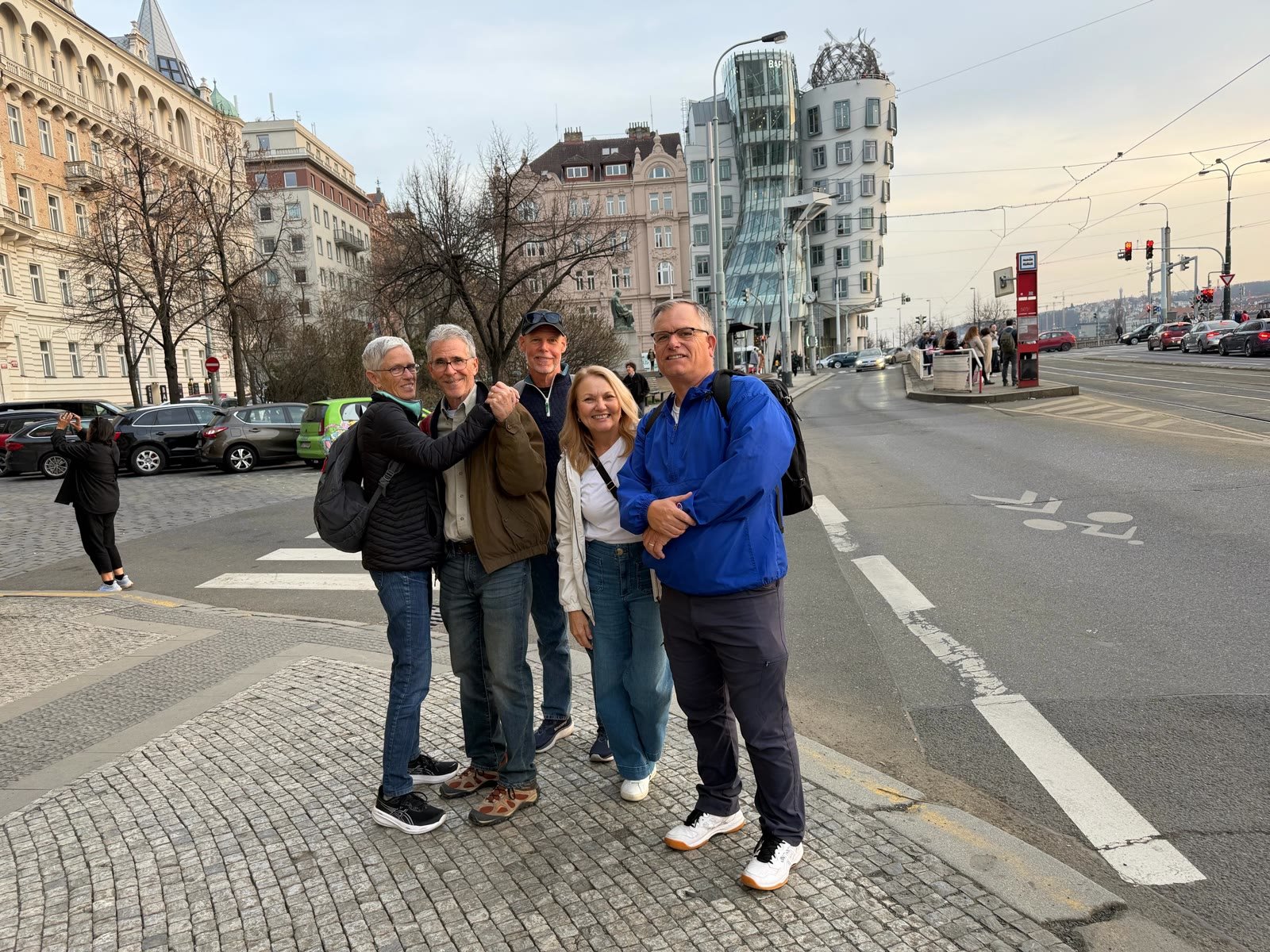 Friends in front of the Dancing House in Prague