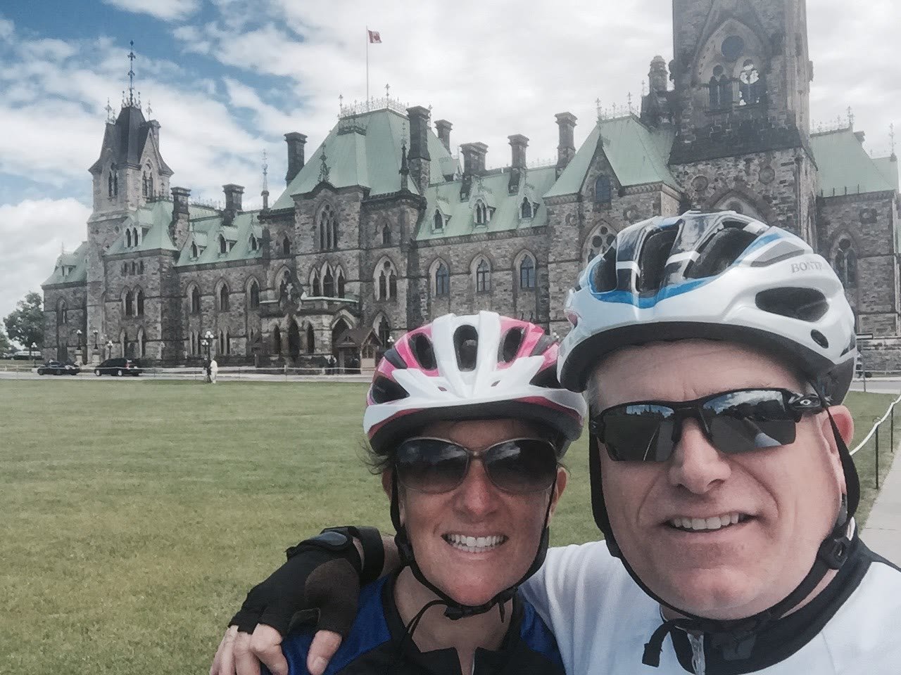 Chuck and Leslie biking at Parliament Hill in Ottawa